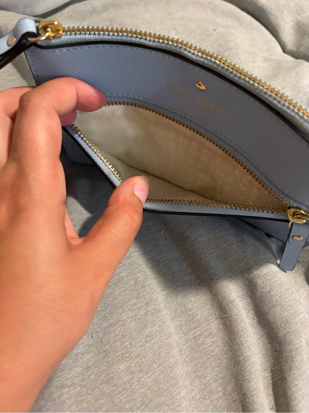 kate spade light blue leather zip wristlet with gold hardware